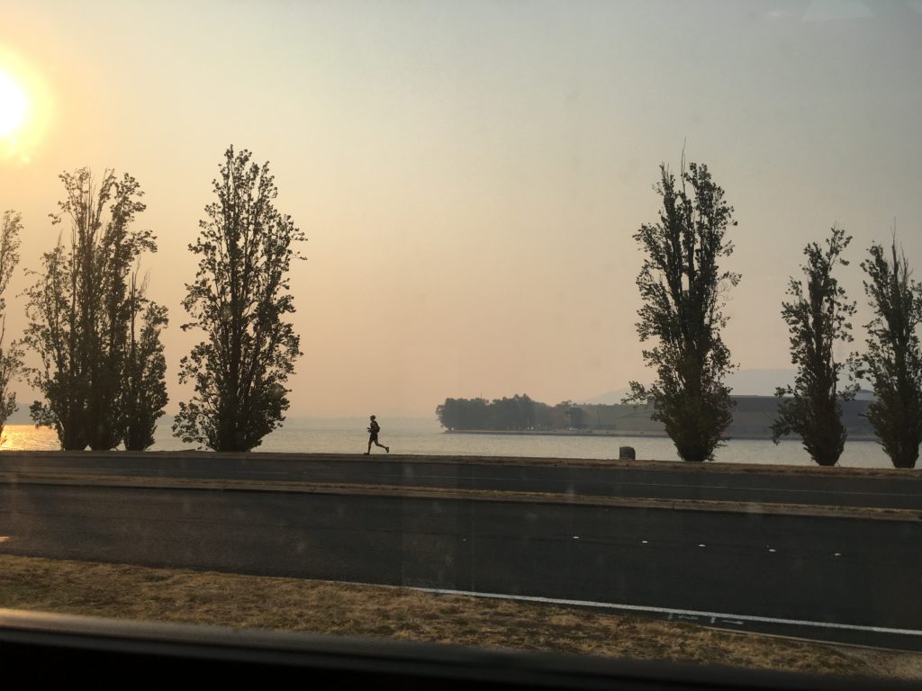 Smoke haze and a runner